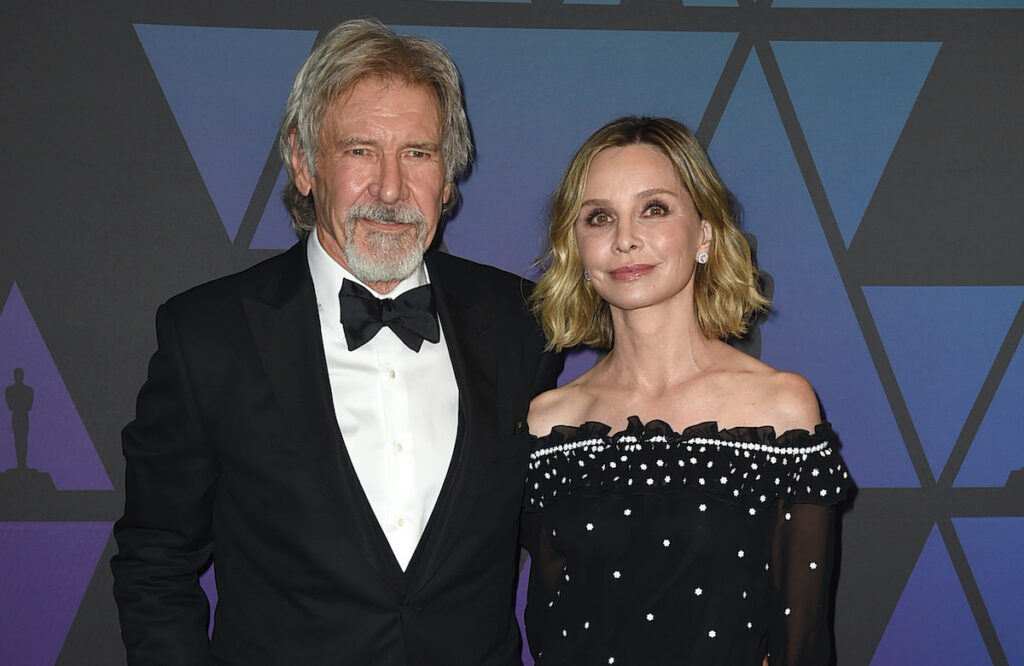 Harrison Ford in a tuxedo with wife Calista Flockhart in a black dress