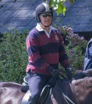 Prince Andrew riding his horse in Windsor accompanied by a groom