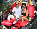 Kourtney Kardashian and Travis Barker share a passionate kiss during their gondola ride in Venice