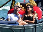 Kourtney Kardashian and Travis Barker share a passionate kiss during their gondola ride in Venice