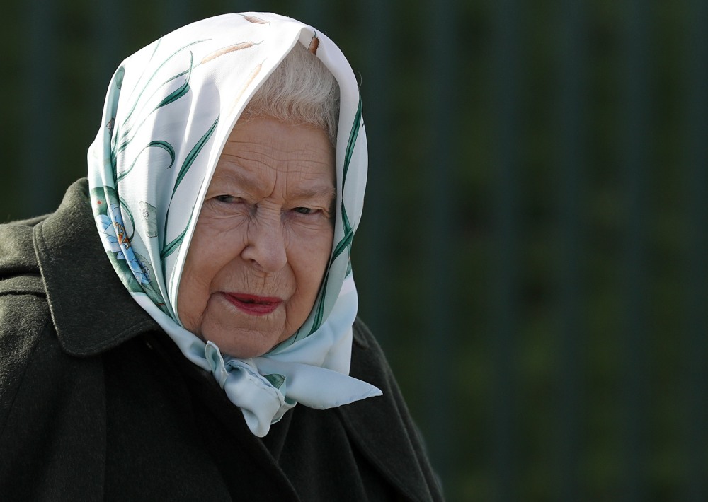 Britain's Queen Elizabeth II reacts during her visit to Wolferton Pumping Station in Norfolk, east of England on February 5, 2020, where she officially opened the new station. - Wolferton Pumping Station allows the surrounding 7,000 acres of marshland, whi